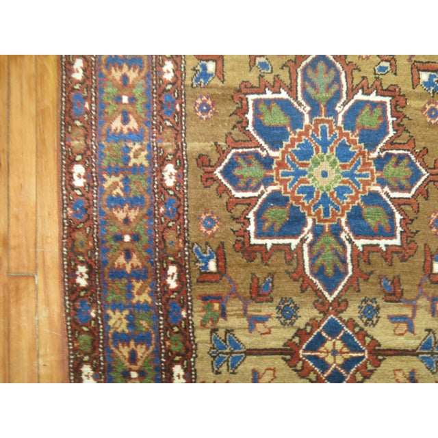 Interesting Persian kurd bidjar runner, accents in different shades of blue, green, orange on a camel abrashed ground....