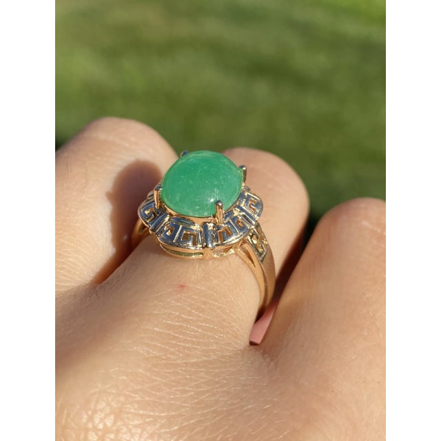 The Wyevale: Ladies 14K Ring set with 4.57 CT Jadeite. Crafted in 14 karat yellow gold, this ladies' cocktail ring is set...