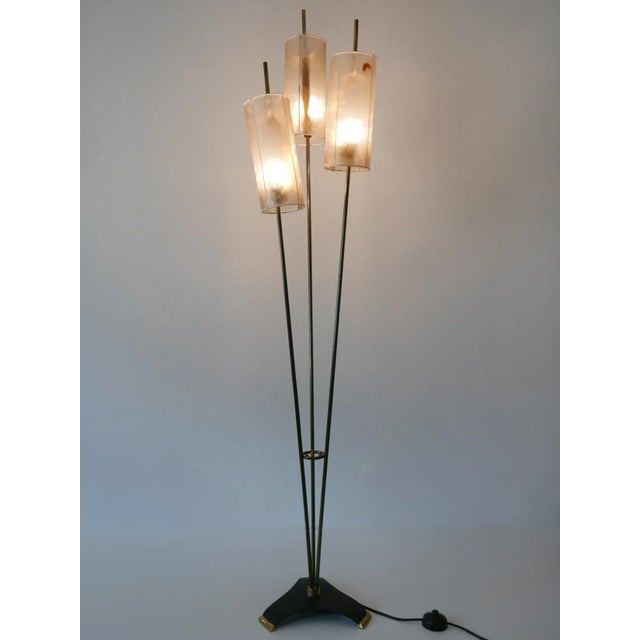 - Rare and elegant Mid-Century Modern floor lamp - Designed and manufactured in Germany, 1950s - Executed in brass, metal...