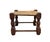 A charmingly quirky antique footstool. Features a solid wood frame with a woven, seagrass rope seat. Handmade in a folk...