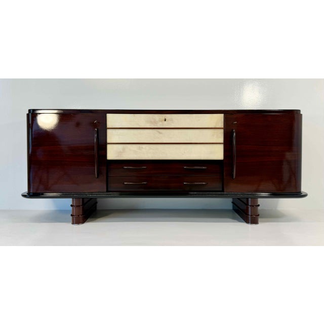 Elegant Art Deco sideboard produced in Italy in the early 1940s, attributable to the design of Osvaldo Borsani. The...