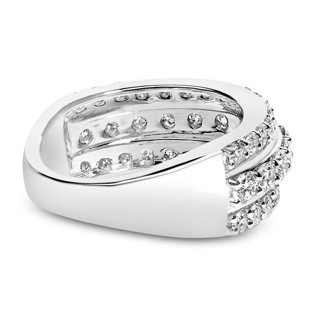 Embrace the sparkle and modern elegance of this exquisite .925 sterling silver ring, plated with lustrous rhodium for...