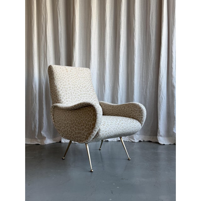 Beautiful Italian mid century armchair reupholstered with Nobilis “Fauve” leopard print fabric. Attributed to Marco...
