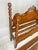 Full-size (double) bed frame dating to the 1930s–1940s Colonial Revival era. This piece features a headboard adorned with...