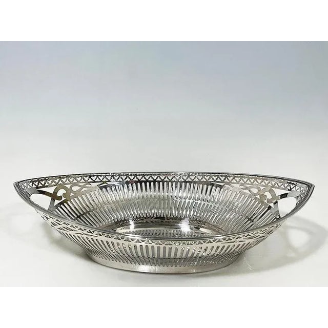 Dutch silver bread basket by Pressburg and Son, Haarlem, 1956 An oval silver bread basket with cut-out vertical lines and...