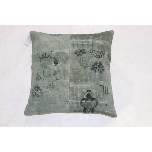 Pillow made from an old Chinese rug predominantly in green. zipper closure and polyfill provided Measures: 23'' x 23''.