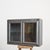 An antique metal medical wall cabinet from dental surgery in the Czech Republic, the cabinet has a pair of glazed doors...