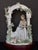 Lladró Tranquility (model #06677) porcelain figurine, featuring a seated woman under a floral arbor. I bought this for my...