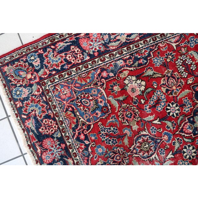 An exquisite 1920s Hand-Knotted Persian Kashan Rug from the renowned Kashan region of Persia, dating to the 1920s. Persian...