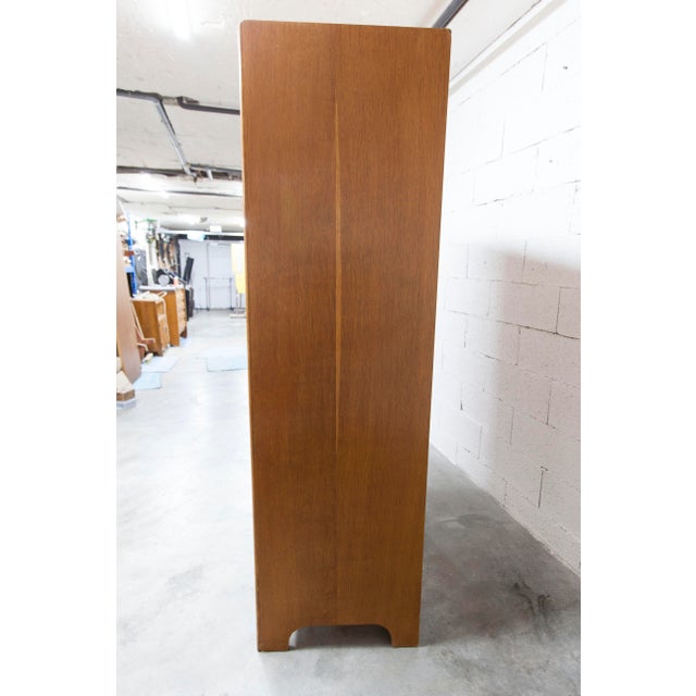 A 1950s Mid-Century Modern wardrobe in oak veneer, using the herringbone technique typical of the 1930s to 1950s. It...