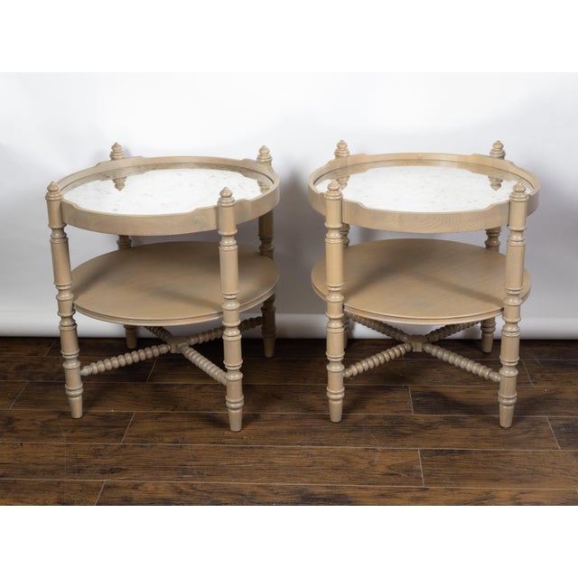 A pair of French vintage oak side tables from the mid 20th century, with mirrored tops and turned legs. Created in France...
