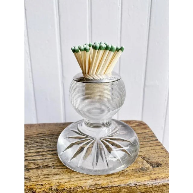 A lovely antique circa 1904 English glass match striker with sterling silver rim. Excellent antique condition, no chips or...