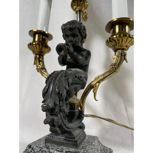 19th Century Louis XV Style Bronze Two Light Table Lamp with Adjustable “Pare-feu“. Elegant late 19th century Louis XV...