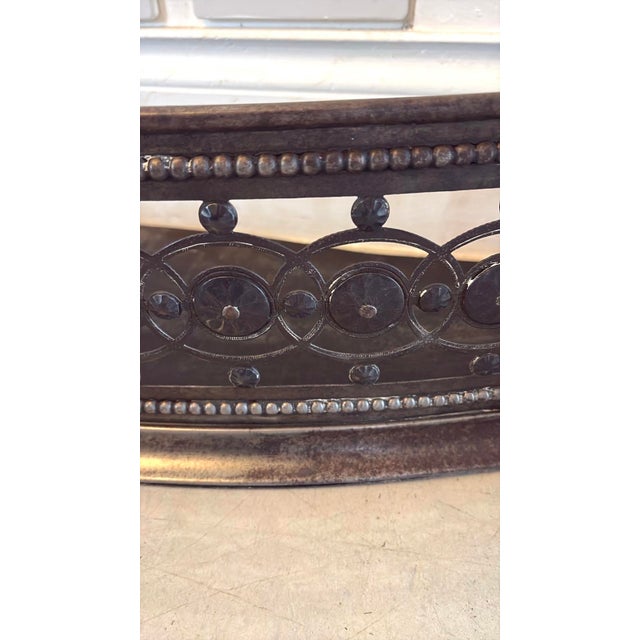 A very attractive antique George III steel fire fender with a beautifully shaped serpentine front. The pierced decoration...