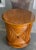 Vintage Lexington Tommy Bahama “Cayman” drum table featuring a warm honey-toned finish with woven rattan panels and a...