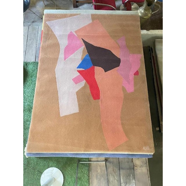 This large-scale hand-tufted wool rug by Tisca, titled and signed “ILES”, embodies the bold artistic vision that defined...