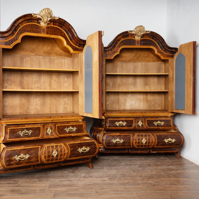Stunning pair of inlaid marquetry rococo cabinets, after a masterpiece by Jonas Hultsten (master in Stockholm 1773-1794)....