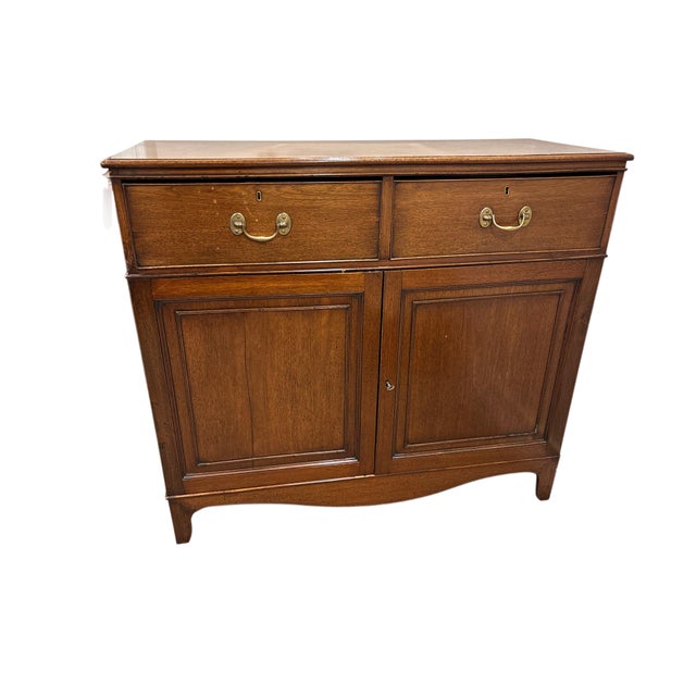 This elegant English Georgian-style sideboard showcases timeless proportions and understated craftsmanship. Crafted from...