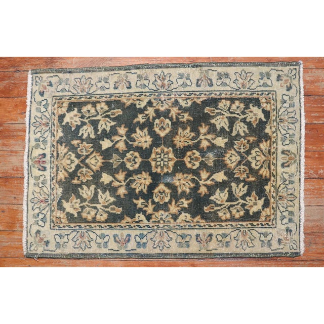A Mid-20th century small throw size hand-knotted Persian Sarouk Rug Mat.