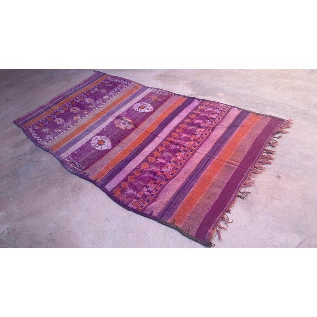 This vintage Moroccan rug is a true powerful women's artistic creation that is the first thing our eyes get caught when we...