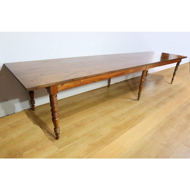 This large community table, which can accommodate between 16 and 20 place settings, has a rear top in solid oak that can...