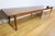 This large community table, which can accommodate between 16 and 20 place settings, has a rear top in solid oak that can...