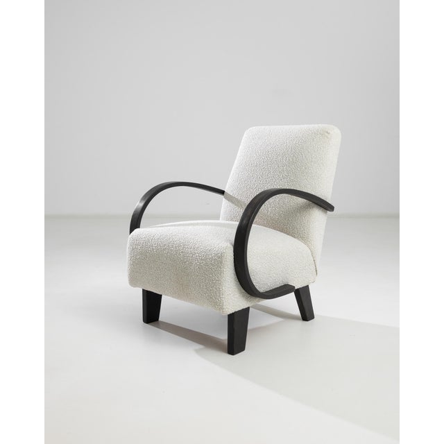 Introducing the 1950s Czech Wooden Armchair by J. Halabala, a timeless piece that combines vintage charm with modern...