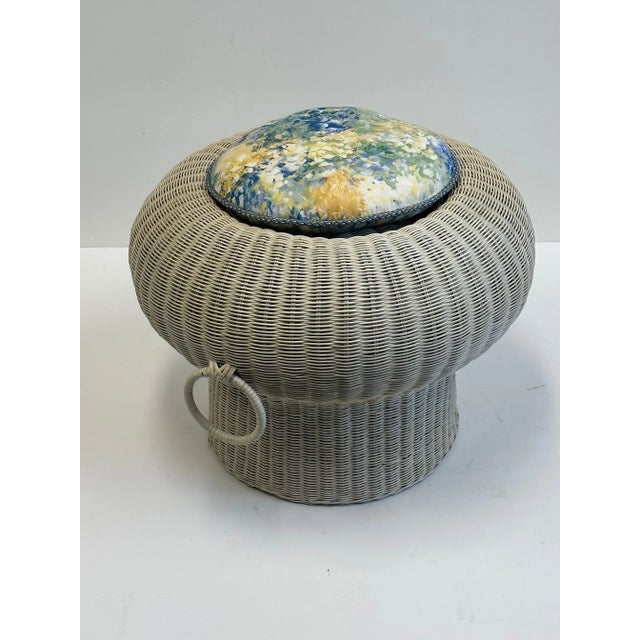 Fun and rare pair of white wicker vintage round ottomans with recessed seat cushions.