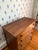 This walnut chest projects an understated beauty with reeding one either side of the drawers and turned feet. On first...
