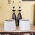 Pair of Contemporary Espresso Wood Hourglass Lamps With Brushed Nickel Accents and Linen Shades For Sale - Image 9 of 18