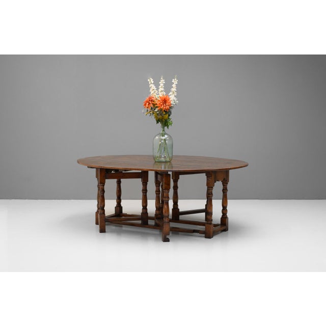 Double gate-leg drop leaf table in oak. Circa 1960.