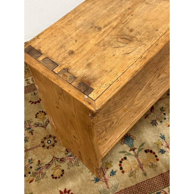 Design Plus Gallery presents a Console Table of Pine Wood with Lower Display Shelf. The table is vintage with natural wood...