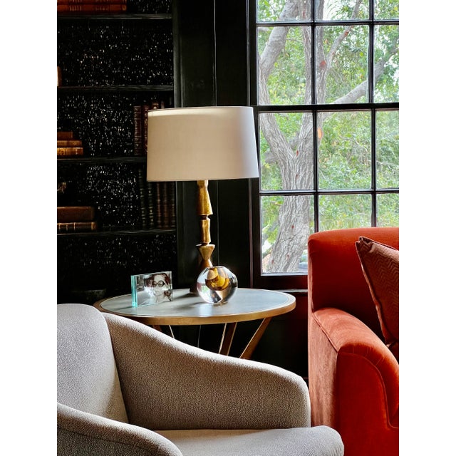 Comfy swivel chair. Fabric is a silvery khaki/taupe color with a slight shimmer. Depending on the lighting, it will pick...