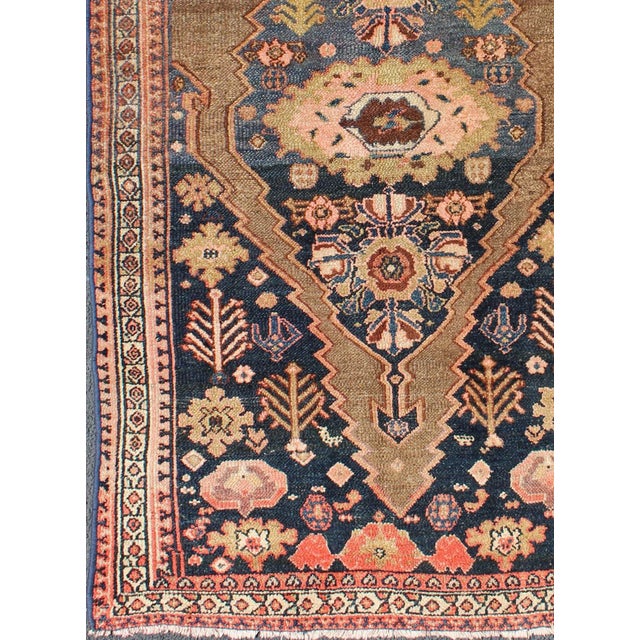 This antique Persian Serab antique rug with Medallion design in camel and shades of blue, Keivan Woven Arts / rug zir-18,...