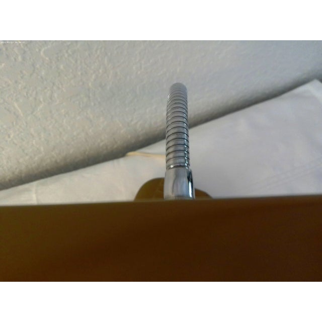 Cool mid-century brown portable desk lamp with adjustable stainless-steel neck. Takes one fluorescent bulb - included....