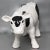 An adorable hand crafted figure of a Holstein cow made of terracotta and having a solid coat of opaque white glaze,...
