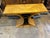 Art Deco Wall Console with geometric curves and high symmetry. Finish is a swirling burl pattern with black ebonized accents.