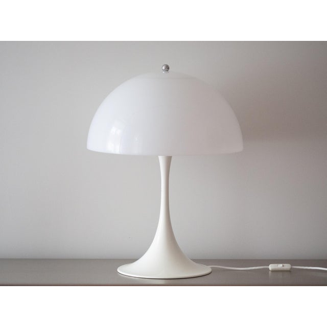 The Panthella desk lamp was designed in 1971 by Verner Panton for Louis Poulsen and is one of the icons of Danish design....