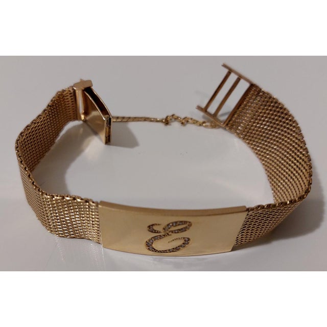 Vintage bracelet from a 1950s omega watch, made of 18k yellow gold with 18 diamonds and weighing 46 grams. It is handmade;...