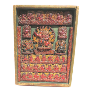 Tibetan Votive Panel of Polychromed Carved Wood.