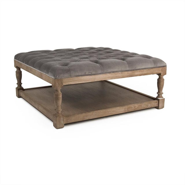 The Square Tufted Ottoman from Zentique is a versatile coffee table alternative with a button-tufted cushion top and a...