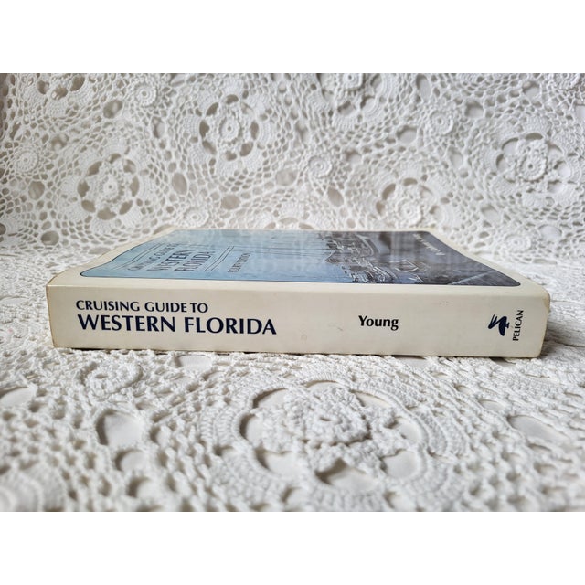 "Cruising Guide to Western Florida", copyright 1998/Fourth Edition. It measures 8" w x 9 1/4" l x 1 1/4" d and shows...