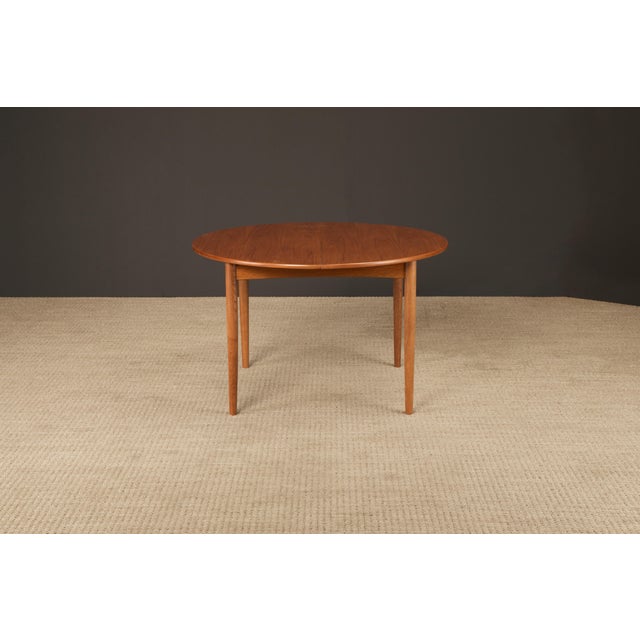 This beautifully refinished Model 311 teak extendable dining table by Peter Hvidt & Orla Mølgaard-Nielsen for Søborg...