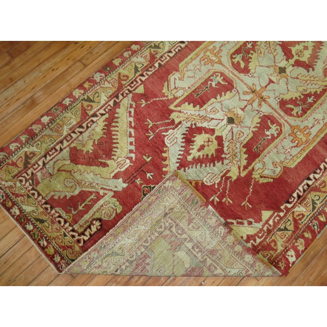 an early 20th century finer quality Turkish Anatolian rug with elaborate center medallion and border in mainly red circa...