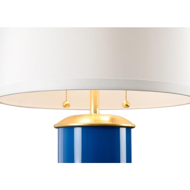 Brighten your home with this charming transitional table lamp. Savannah features a colorful glass cylinder with a dazzling...