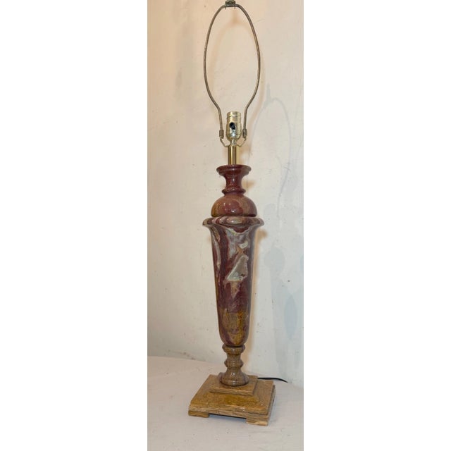 This large and heavy table lamp features a striking purple, brown, and green onyx stone base, giving it a unique and...