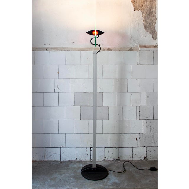 Floor lamp with metal structure, cast iron base, opal glass diffuser. Olympia model Designer Carlo Forcolini Manufacturer...