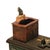 Add a touch of Victorian-inspired whimsy to your shelves with this heavy-duty cast iron mechanical bank. Titled "Cat and...