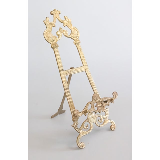 A gorgeous antique Art Nouveau ornate solid brass table size art easel or picture stand. This lovely stand is a nice large...