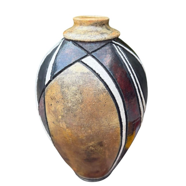 Striking vintage studio pottery vase featuring a hand-crafted geometric design accented by a richly iridescent raku-fired...